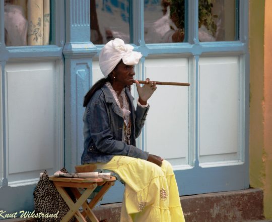 Cigar smoking woman in Havana, Cuba